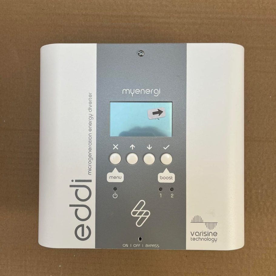 White and grey electronic device with a digital display and control buttons.